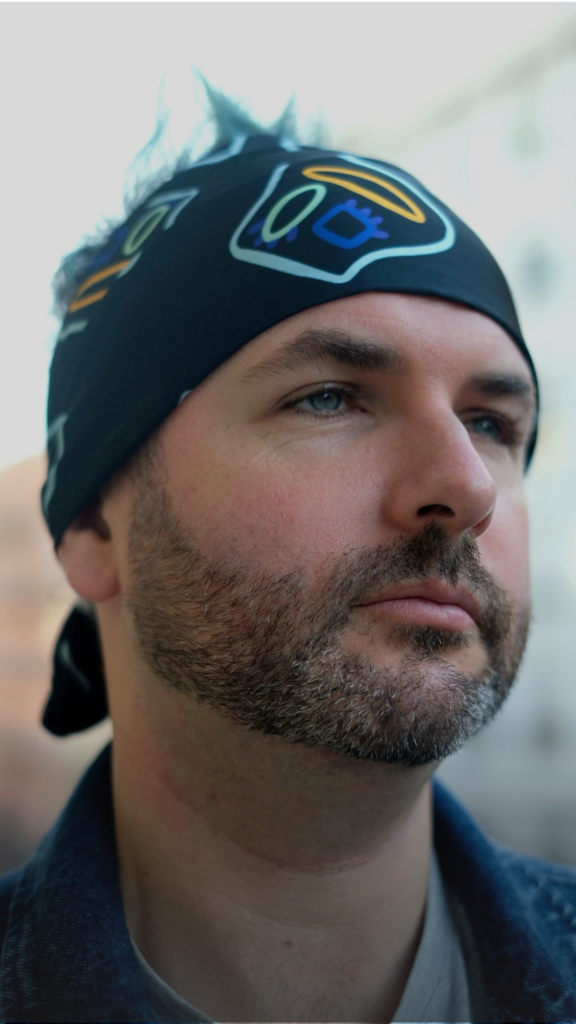 Man wearing printed scarf